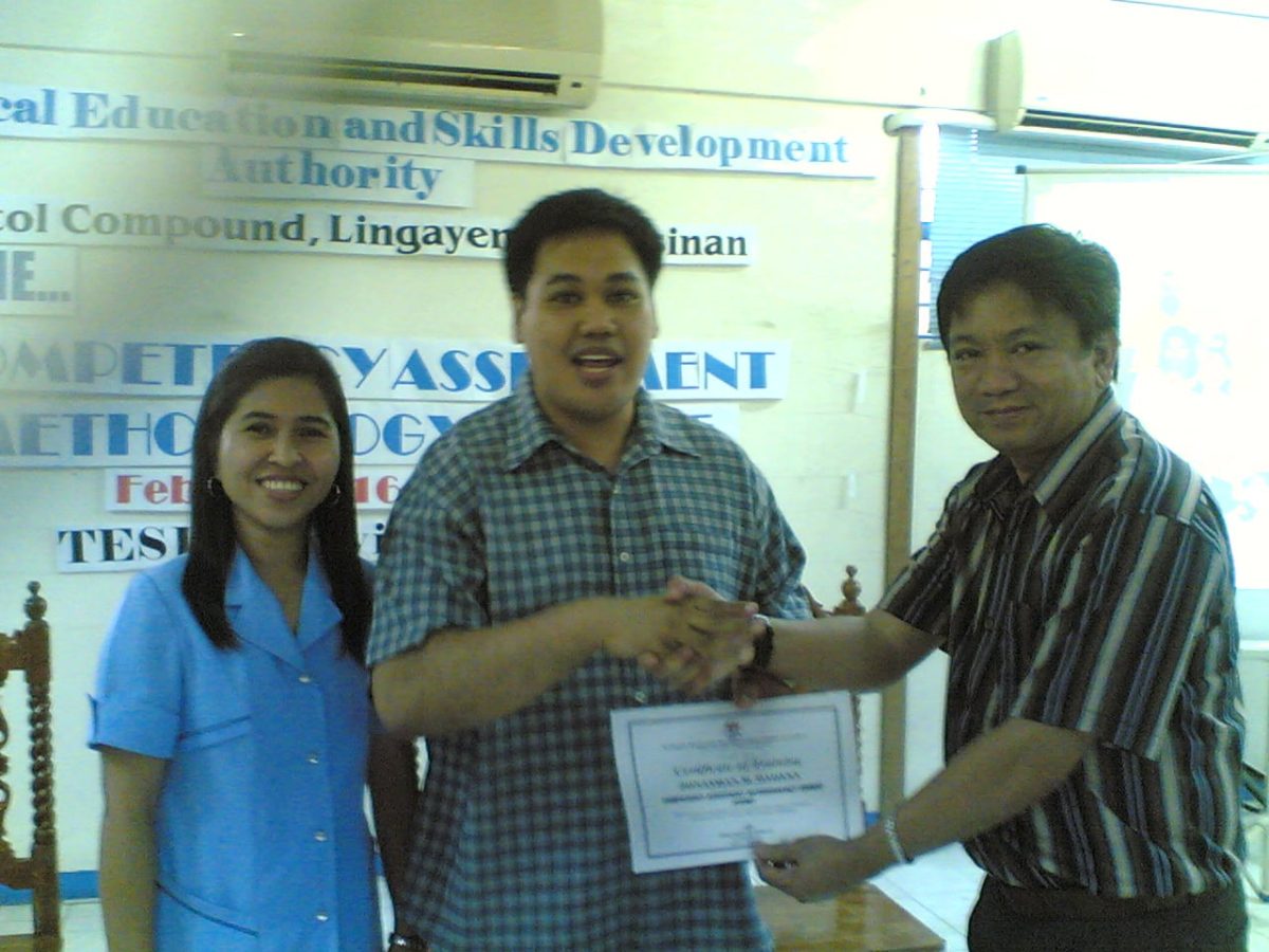 FOCI Head for Training, Jonathan Daoana, being awarded with his certification by TESDA Provincial Director Ponciano Catipon Jr
